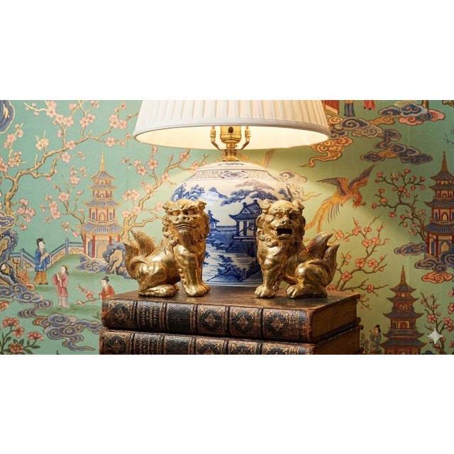 Bring timeless protection and prosperity to your space with this striking pair of gold gilt Foo Dog statues, also known as...