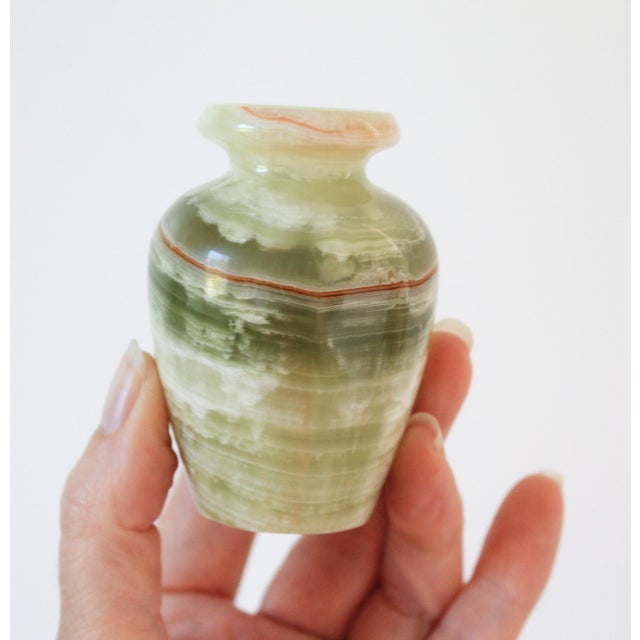 Vintage green onyx polished stone small bud vase. No makers mark. Minor age wear. No chips or cracks.