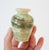 Vintage green onyx polished stone small bud vase. No makers mark. Minor age wear. No chips or cracks.