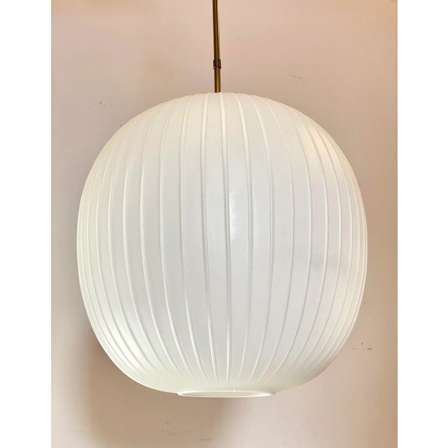 60s pendant light, diffuser (h.42cm.) In opal white glass and brass structure European Plug (up to 250V).The wiring of...