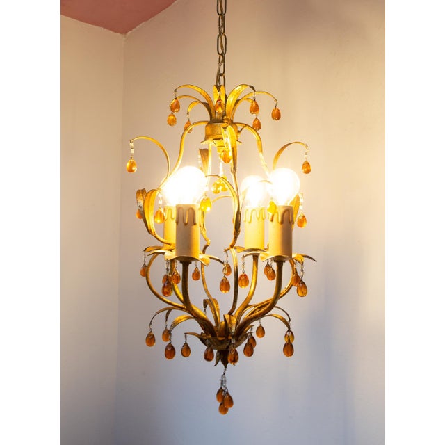 It uses four E14 bulbs. Dimensions: ⌀ 30 cm. It hangs down a total of 78 cm; the minimum height is 54 cm. Up to 250V...