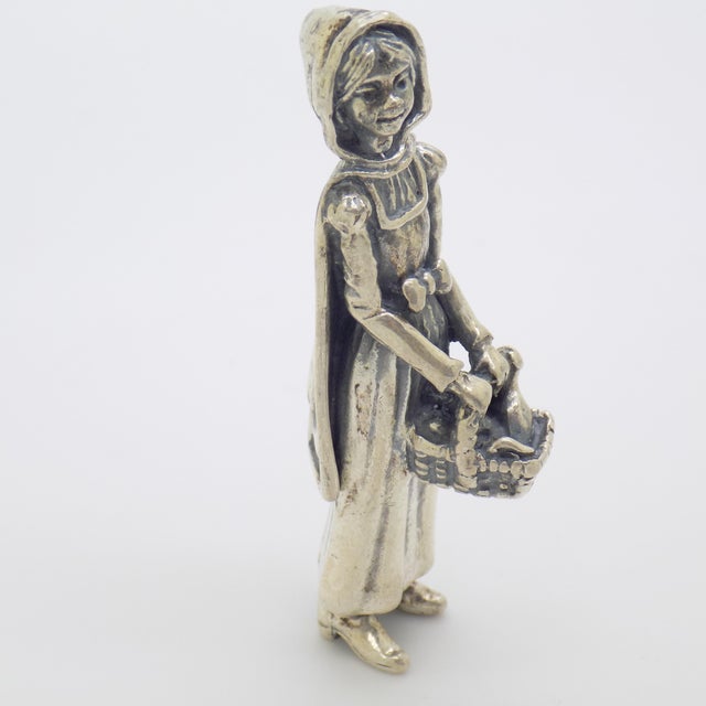 Rare vintage solid silver figurine depicting Little Red Riding Hood carrying her basket, created in Arezzo, Tuscany,...