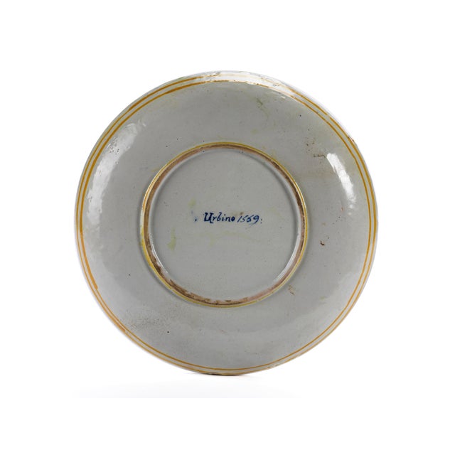 A similar plate, dated 1540–1560 and depicting the same scene but with a different coat of arms, is kept in the Museo...