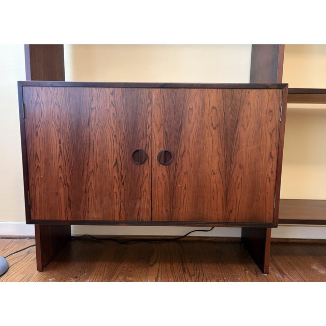 Beautiful Mid-Century Danish Rosewood Wall Unit with Adjustable Shelving Adjustable shelving on either side. Cabinet on...