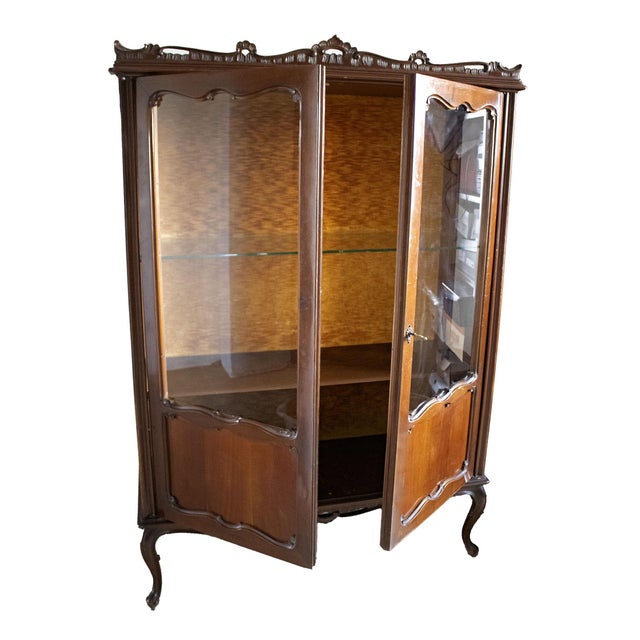 This display cabinet is a refined example of Lombard Baroque-style furniture dating back to the first half of the 20th...