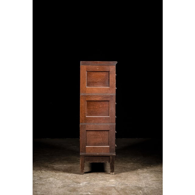 This eighteen drawer apothecary cabinet features all japanned copper hardware from top to bottom. The cabinet separates...