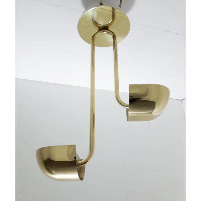 Original vintage Italian flushmount pendant with double gold shades suspended at different heights from elegant curved...