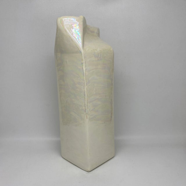 Vintage ceramic milk carton vase with an white iridescent glaze. Perfect for florals or as a pop art piece on a shelf.