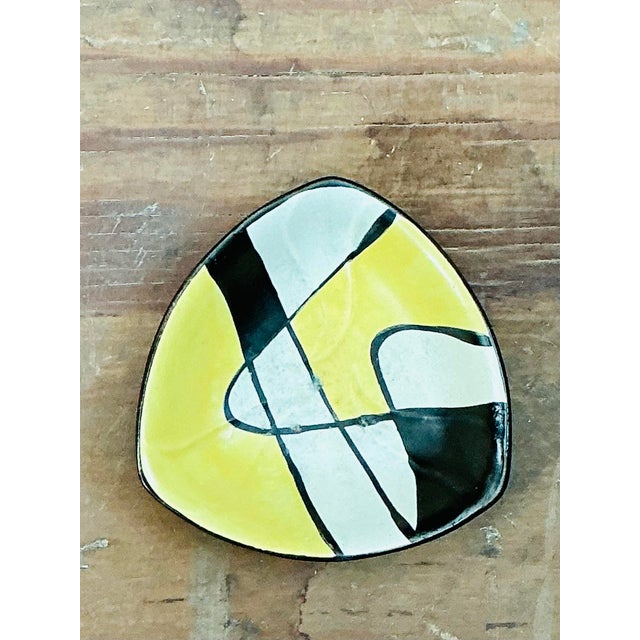 Exuding Mid-Century Modern charm, this vintage West German art pottery bowl features a striking abstract geometric pattern...