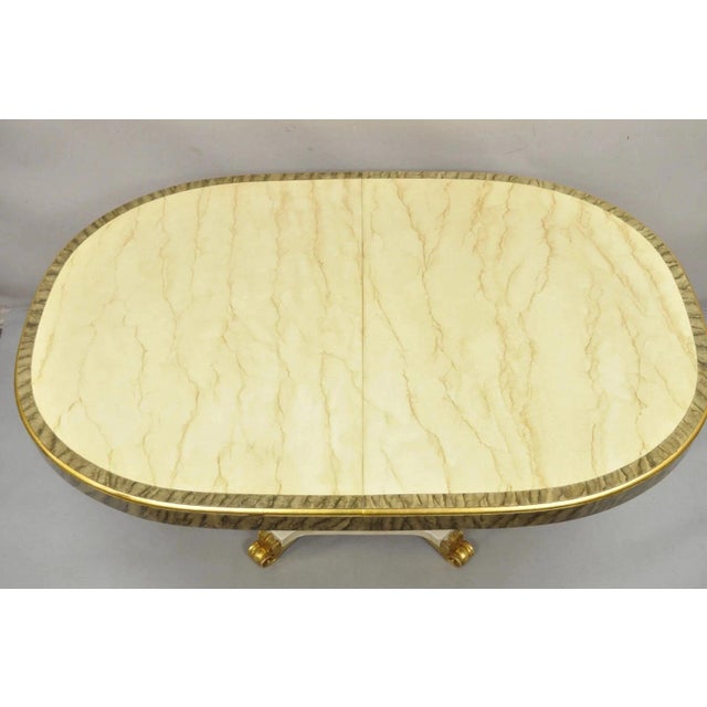Vintage Italian Regency Style Cream & Gold Gilt Lacquered Urn Pedestal Base Dining Table with 3 Leaves. Item features 3...