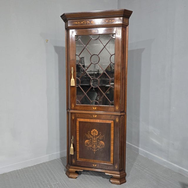 Super quality mahogany two piece corner cabinet, with outstanding quality inlays, in excellent overall condition. 82" high...
