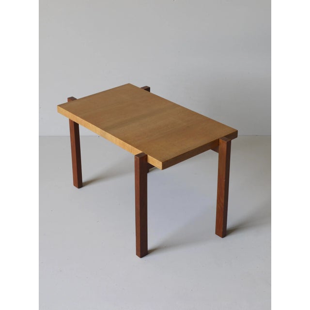 This French side table features cherry wood legs and an ash wooden top.
