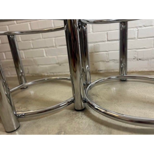 A striking piece of postmodern glamour, this oval coffee table features a sculptural chrome base built from interlocking...