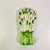 A pretty and stylish Asparagus Bunch Ceramic Spoon Rest. It features a color palette of bright green, dark green, pink and...