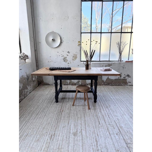 Antique oak farmhouse table with two extensions. we love its look, with its turned wood legs and stretcher. originally...