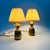 A pair of small vintage table lamps with brass bases in the shape of pineapples. Pleated white shades are included. Each...