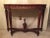 This is a reproduction curved solid mahogany console - hand carved and stained in a multi-step process. It is a copy of an...