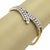 This is a beautiful Estate bracelet, crafted from 18k yellow and white gold featuring a bypass design in white gold at the...
