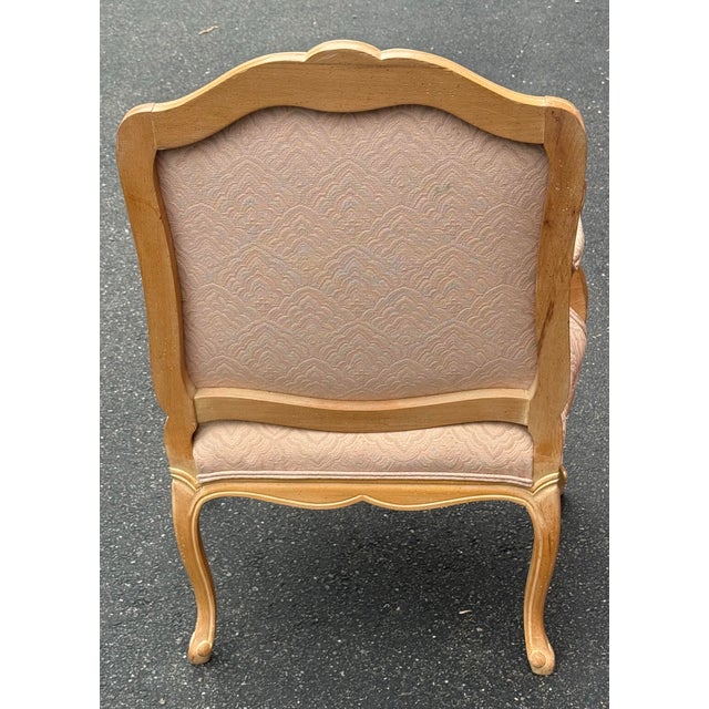 Beautiful Louis XV Bergere chair in a blonde Cerused finish. Features beautiful carved details, pale pink upholstery and...