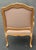 Beautiful Louis XV Bergere chair in a blonde Cerused finish. Features beautiful carved details, pale pink upholstery and...