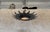 This striking Spanish 1950s metal ceiling fixture features two tiers of overlapping hand-formed leaves arranged in a...