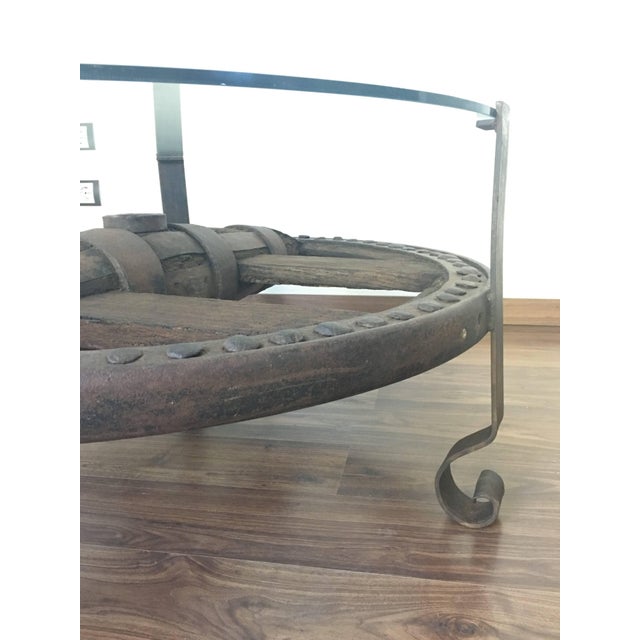 Wooden Wagon Wheel Indutrial Accent Spanish Table With Glass Top For Sale - Image 4 of 11
