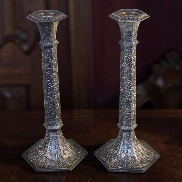 These Antique Victorian Pr. Repousse Tavern Dutch Scene Silverplate Derby Candlesticks are a beautiful addition to any...