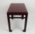 Rectangular side table with a rounded top on the corners, a gallery under the top, made up of a horizontal bar and two...