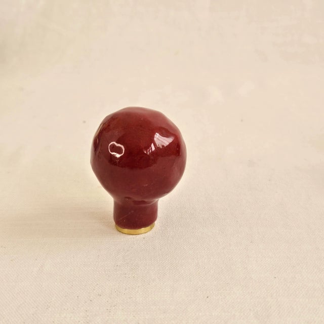 Pair of large round organic shaped ceramic lamp finials in Ruby/Burgundy red. These ceramic finials were first hand-formed...