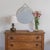 Incredible Art Deco mirror from France, 1930s. Scalloped mirror with beveled edge secured to a wooden back. Lovely etched...