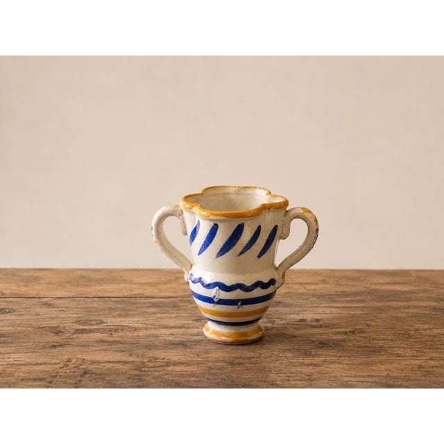 A fascinating antique bi-handled glazed majolica pitcher, a splendid example of rustic folk art from Southern Italy,...