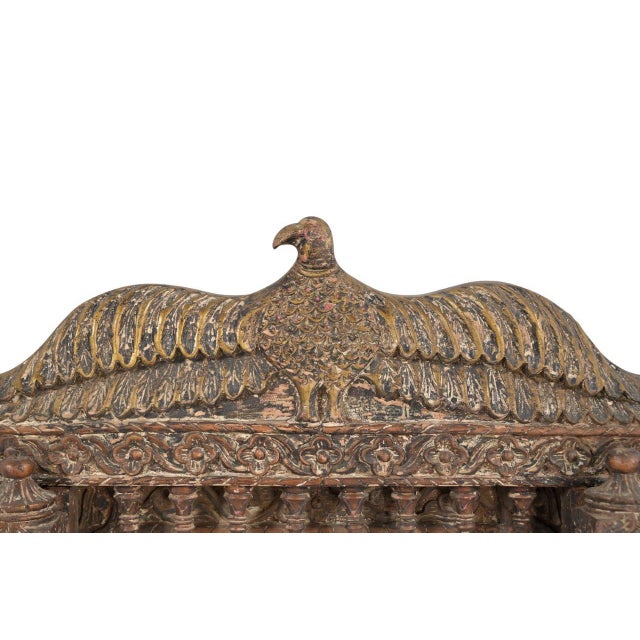 This Antique Indian Carved Teakwood Architectural Frame has been handcrafted from solid teakwood, with floral carvings,...