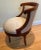 This is a very unusual wooden upholstered chair that spins 360 degrees like a barrel chair. The wood is in good shape but...