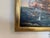 This striking oil on canvas painting depicts a dramatic naval battle scene, with historic sailing ships engaged in close...