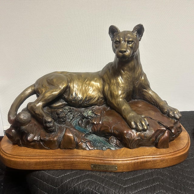 Experience the compelling artistry of Danny D. Edwards (1947-2023) with the bronze sculpture titled "Cougar Bluff"....
