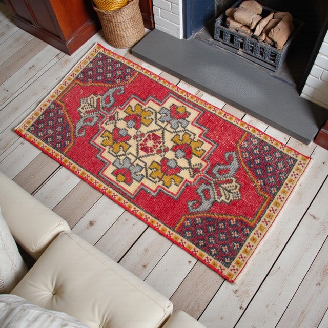 Introduce a touch of authentic Anatolian heritage to your interiors with this exquisite vintage Turkish mat. Meticulously...