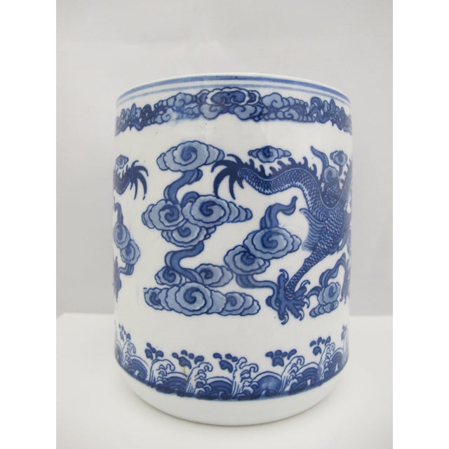 Chinese porcelain brush pot or bitong in white porcelain decorated with blue dragon in clouds motif Measures 5 1/2" tall x...