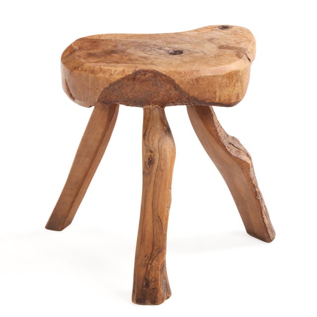 This live-edge wooden tripod stool features a natural slab seat and formidable hardwood legs. Its size allows flexibility,...