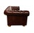 Stylish burgundy or oxblood tufted leather sofa with brass upholstery tacks in the iconic Chesterfield style. This...