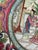 Exquisite early 20th century Chinese export-style Famille Rose porcelain decorative plate. Featuring a meticulously hand-...