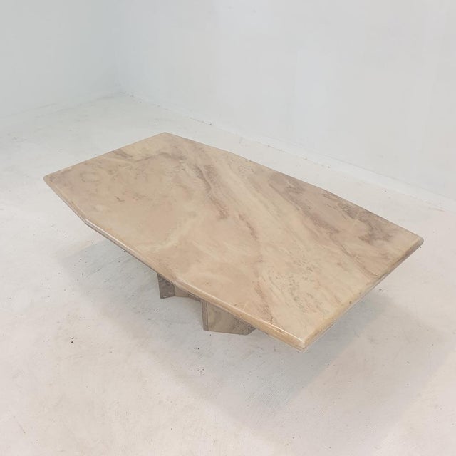 Very nice Italian coffee table handcrafted out of marble, 1970s. The beautiful top is rounded on the edge. It is made of...