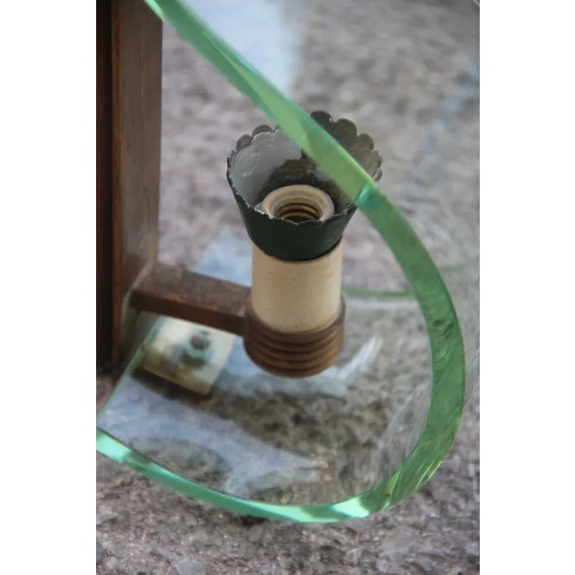 Curved Glass & Brass Sconce, 1950s, in Good conditions. Designed 1950 to 1959 Up to 250V (Europe/UK Standard).The wiring...