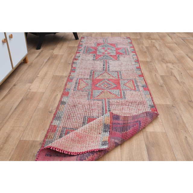 Vintage Turkish Hand-Knotted vintage rug is a semi-antique vintage runner rug. The '70s Eastern region of Turkey's unique...