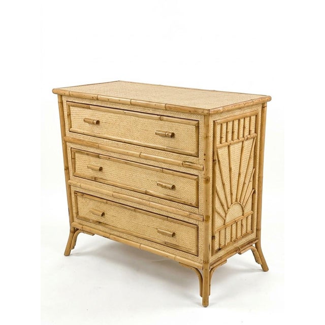 This vintage three-drawer chest features natural bamboo pole frame construction paired with tightly woven cane paneling....