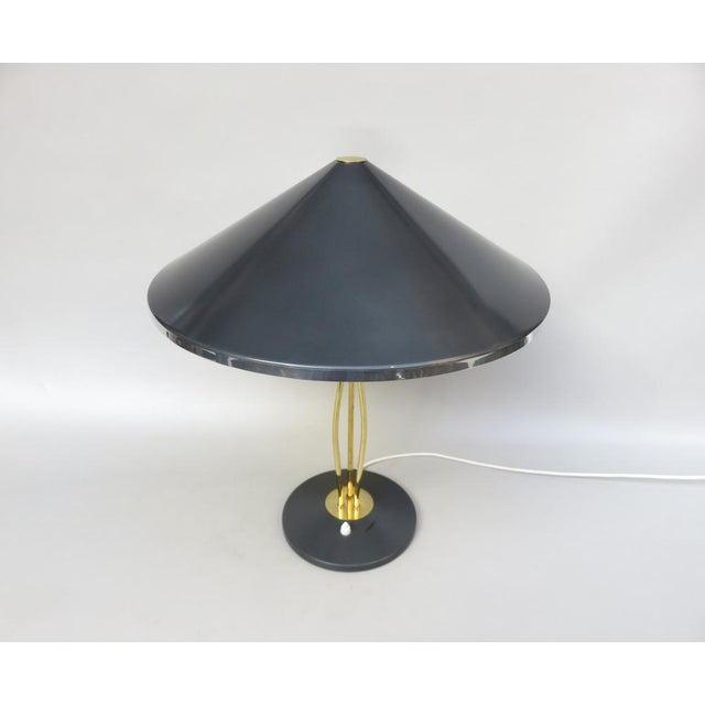 An extraordinary and at the same time rare table lamp from Hala from the 1950s. In the design it shows Asian style...