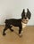 Antique, heavy, cast iron doorstop in the form of a Boston Terrier Dog. Chippy black and white paint.
