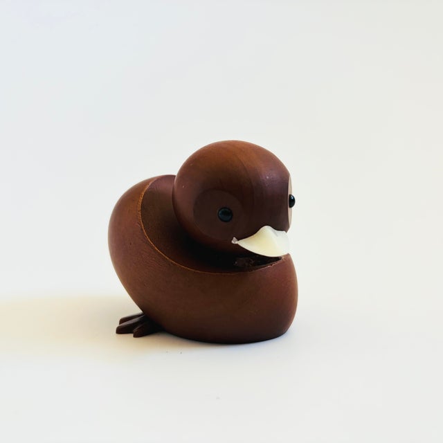 A mid century turned wood figurine in the shape of a Mandarin Duck. Adorable stylized features. Made in Japan by Senshukai...