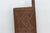 From the Voltaic-speaking regions spanning Burkina Faso and Mali, this single-plank shutter is carved with a dense waffle-...