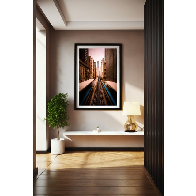 This striking long-exposure photograph captures the pulse of downtown Chicago from the Adams and Wabash station. A streak...