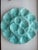 Mid-20th century oyster platter from Gien, Loire Valley, France. Turquoise glaze, scalloped edge, twelve shell-form wells...